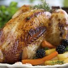 Roasted chicken on wooden plate