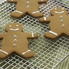 Woman removing cookies from oven