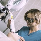 Woman receiving alternative therapy on face