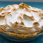 Meringues on crumpled paper top view