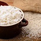 Unpolished rice on wooden background