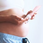 Pregnant woman with a heart symbol on her stomach