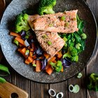 Bowl of salad with salmon and roasted vegetables