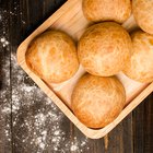 Homemade bread with spikelet of wheat on cloth on boards