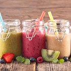 Freshly blended fruit smoothies of various colors and tastes