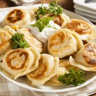 Ukrainian borsch soup and garlic buns on the table. Horizontal