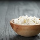 Variety of cheeses on cutting board