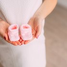 Happy man and woman with pregnancy test