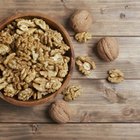 Hazelnuts on square bowl on wood