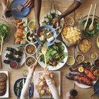 Family Gathered Around Picnic Table