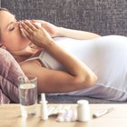 Pregnant woman taking medicine