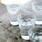 Smiling girl holding water glass