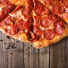 Cauliflower pizza crust with tomato and spinach