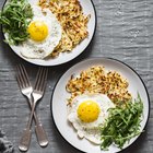 Scrambled eggs on Pan with grilled toast.