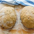 Close up of male baker hands kneading dough