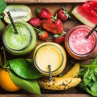 Closeup of smoothie with fresh fruits, seeds, nuts and oats