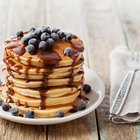 Stack of pancakes with butter on a plate