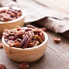 Active Senior woman with handful of walnuts