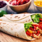 Stack of Homemade Tortillas on floured surface