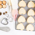 Homemade vanilla cupcakes on a wooden serving plate