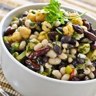 Top view of various legumes with cookware