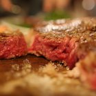 Beef steak on wooden table