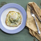 Scrambled eggs on Pan with grilled toast.