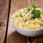 Scrambled eggs on Pan with grilled toast.