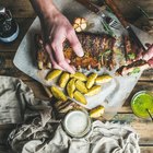 Classic BBQ ribs on parchment paper with BBQ sauce