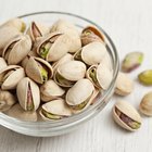 Bowl with pistachios on the table. Top view.