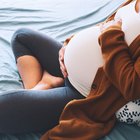 pregnancy woman sit on a chair near the window