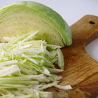 Closed Up Image of a Cabbage With Water drops On it, Surrounded By Other Vegetables, High Angle View