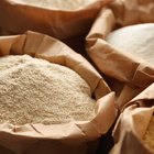 Flour in a bowl on a rustic wooden kitchen table