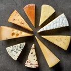 Cheeses on cutting board