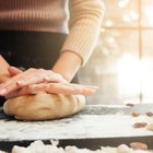 Sliced homemade French bread on sackcloth