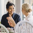 Woman Comforting Unhappy Senior Friend Outdoors