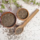 Flour in a bowl on a rustic wooden kitchen table