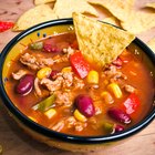 Crock-pot turkey chili in a white bowl on a wooden table