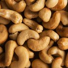 Hazelnuts on square bowl on wood