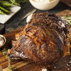 A slab of beef and onions on a baking tray