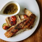 Grilled Tilapia with herbs on the wooden board