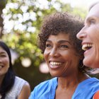 middle-aged woman smiling peacefully with eyes closed