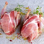 Raw boneless lamb leg with garlic and rosemary