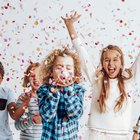 Cute children blowing together on the candle during a birthday party