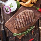 Grilled beef steak with rosemary, salt and pepper