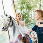 Little girl on kiddie ride at amusement park