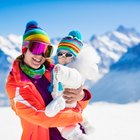 Portrait of a Mother and Her toddler in Woollen Hats in the Snow