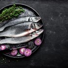 Sea bass fillet on wood background