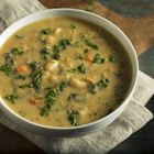 white beans in tomato sauce in a wooden bowl