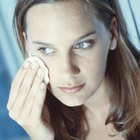 Woman applying eye cream